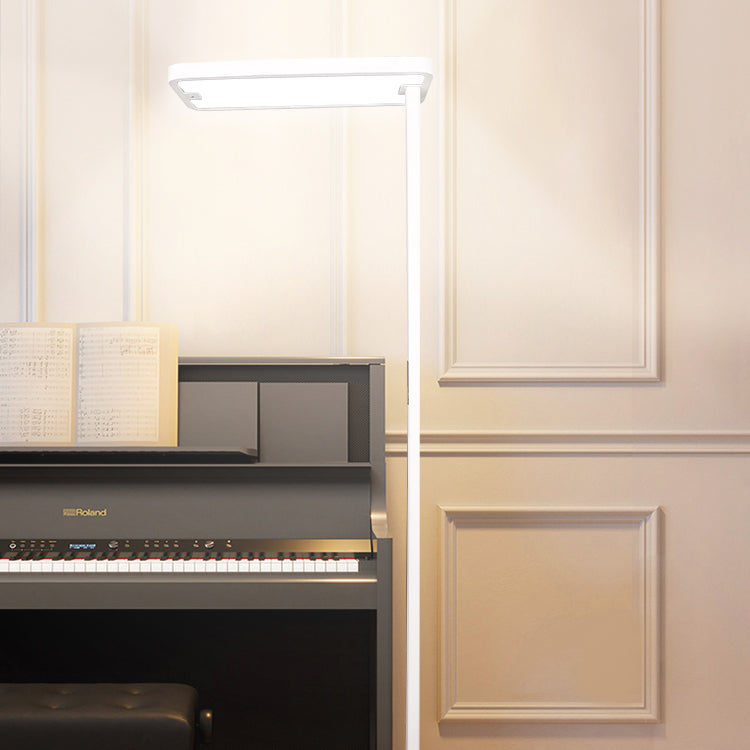 There is a piano that is being lit with the Ovosun lamp the sheet music is easy to read and the lighting is gentle.