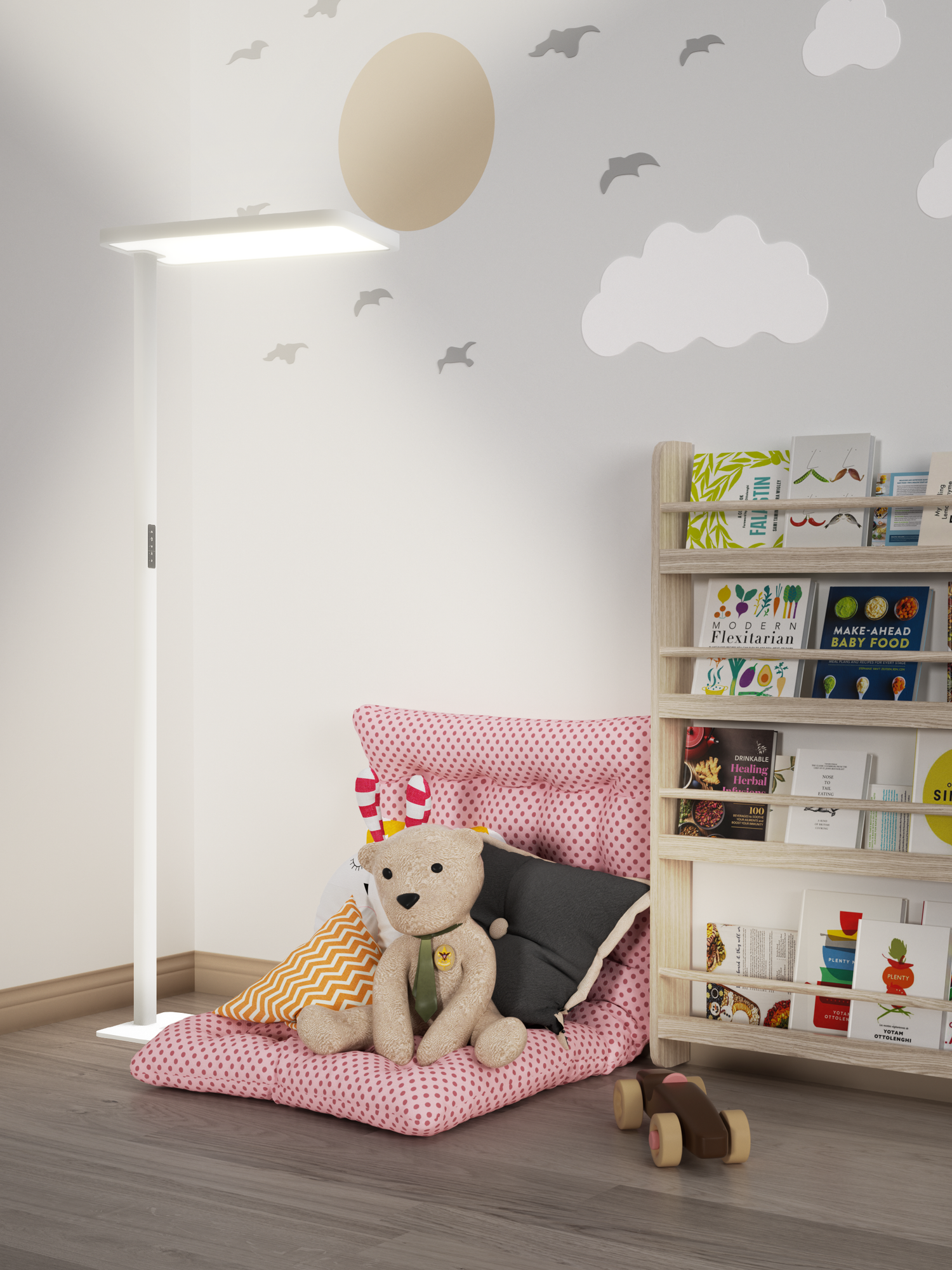 The lamp is lighting up a small kids room full of kids books and stuffed animals it's light is focused on the kids mat where a infant of child would play or read a book.